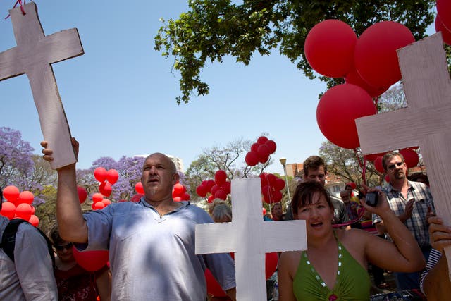 <p>File. White South Africans holding crosses march to protest against the violent murder of farmers which they term ‘genocide and oppressive state policies in favour of blacks’ in Pretoria in 2013</p>