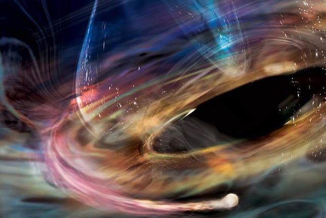 <p>In this artist’s rendering, a stream of matter trails a white dwarf orbiting within the innermost accretion disk surrounding 1ES 1927’s supermassive black hole</p>