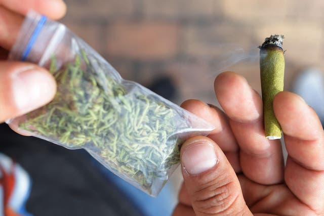 <p>File. Man smokes marijuana during 'Cannabis at the park' festival in Bogota, Colombia</p>