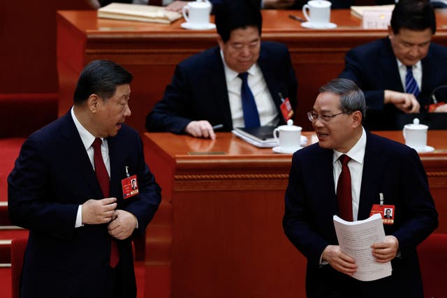 <p>Chinese president Xi Jinping and Chinese premier Li Qiang attend the opening session of the National People's Congress</p>