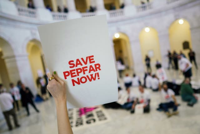 <p>Protesters in the U.S. Capitol campaign against cuts to USAID's AIDS’ treatment  program. A group estimated that nearly 15,000 have died since President Donald Trump froze the agency’s funding</p>