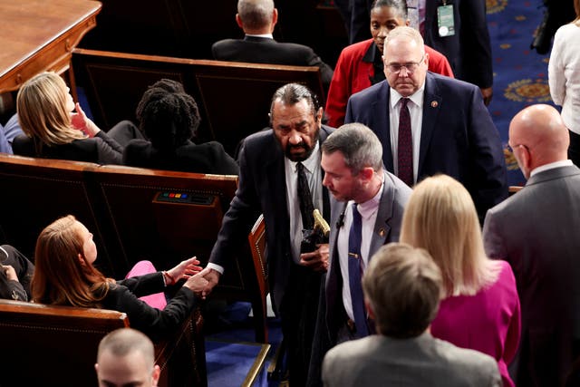 U.S. Rep. Al Green (D-TX) is escorted out after shouting during U.S. President Donald Trump's speech to a joint session of Congress, in the House Chamber of the U.S. Capitol in Washington, D.C., U.S., March 4, 2025